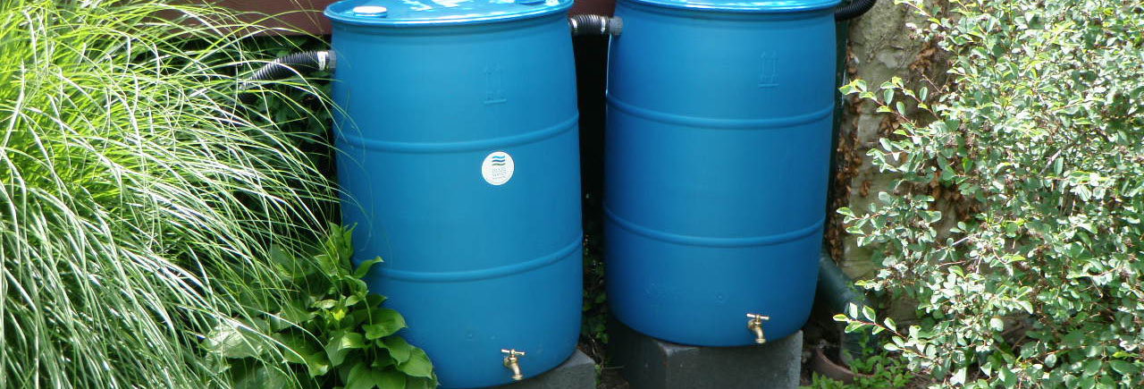 two large blue barrels sitting next to each other