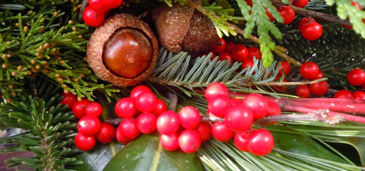 christmas decorations with pine cones and red berries