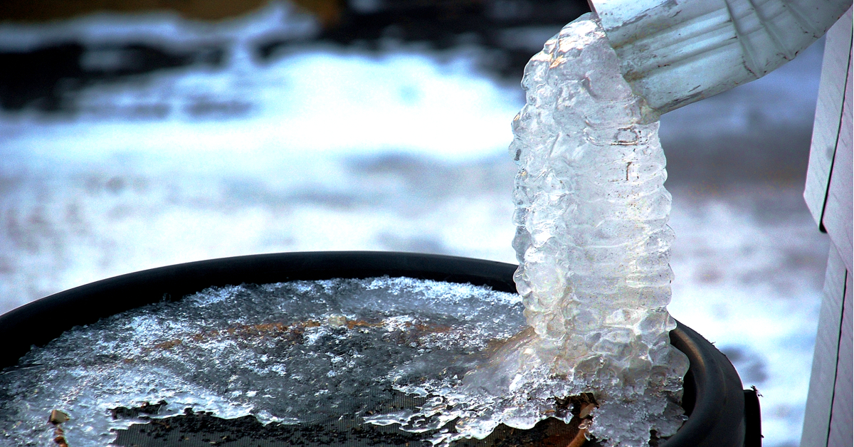a bucket filled with ice and water pouring out of it