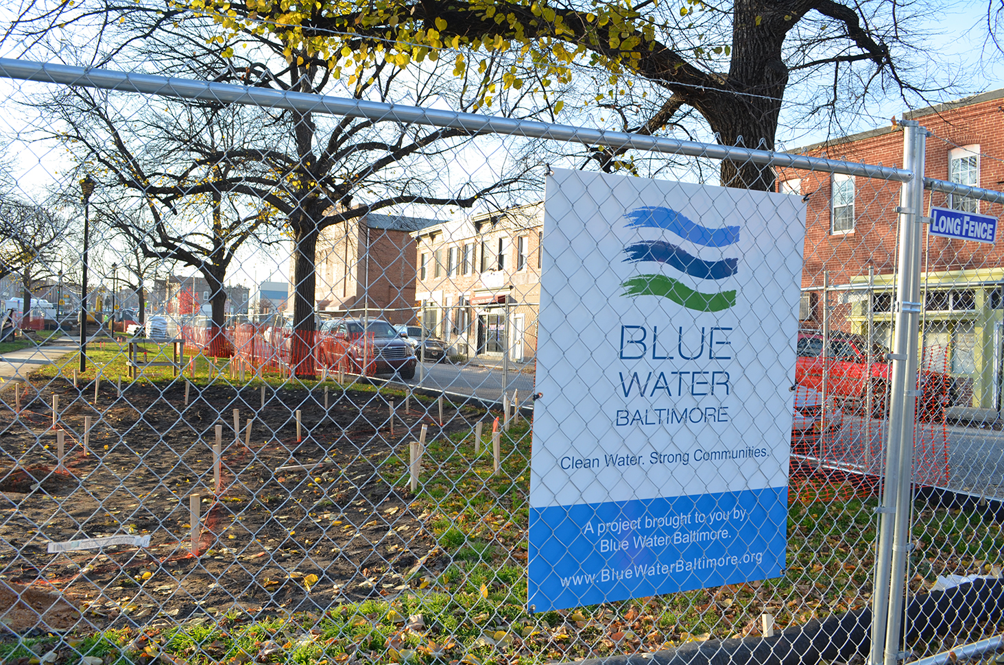 a sign on a chain link fence that reads blue water balance