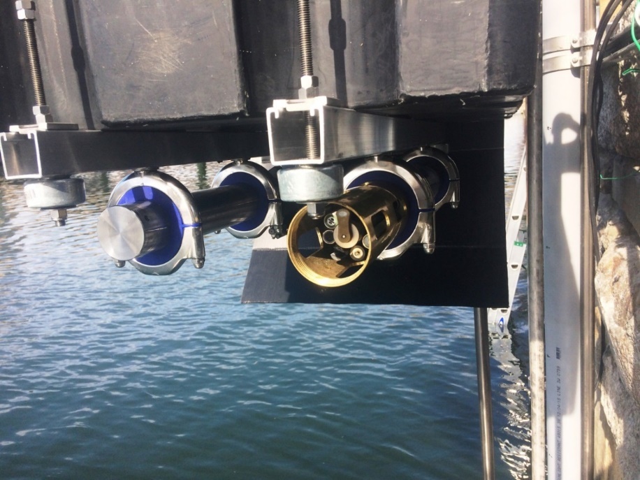 a close up of a boat's engine on the water