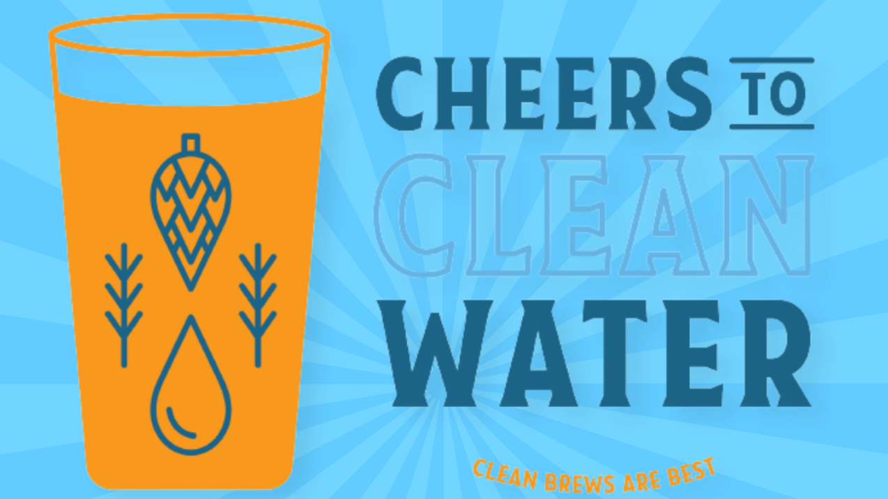 a glass filled with water and the words cheers to clean water