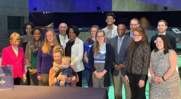 Blue Water Baltimore staff and environmental advocates pictured with Mayor Young immediately after he signed the Baltimore plastic bag ban bill into law. 1/13/2020