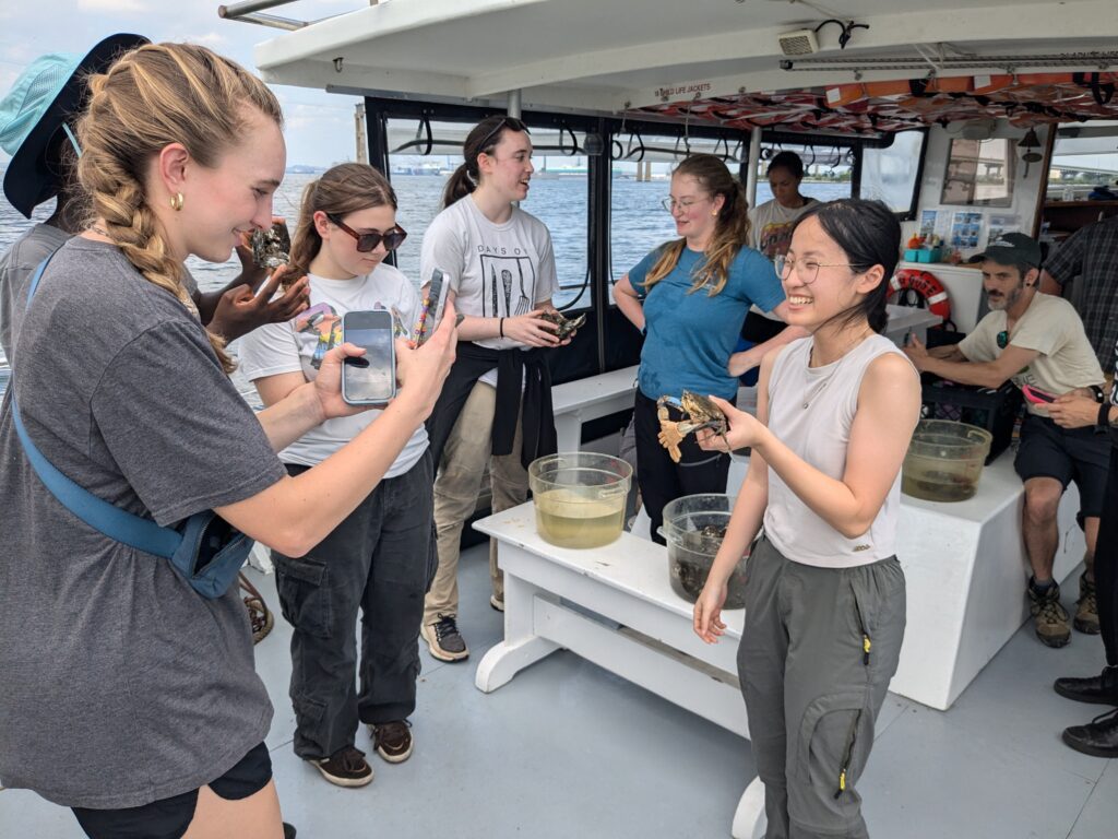 a group of people standing on a boat