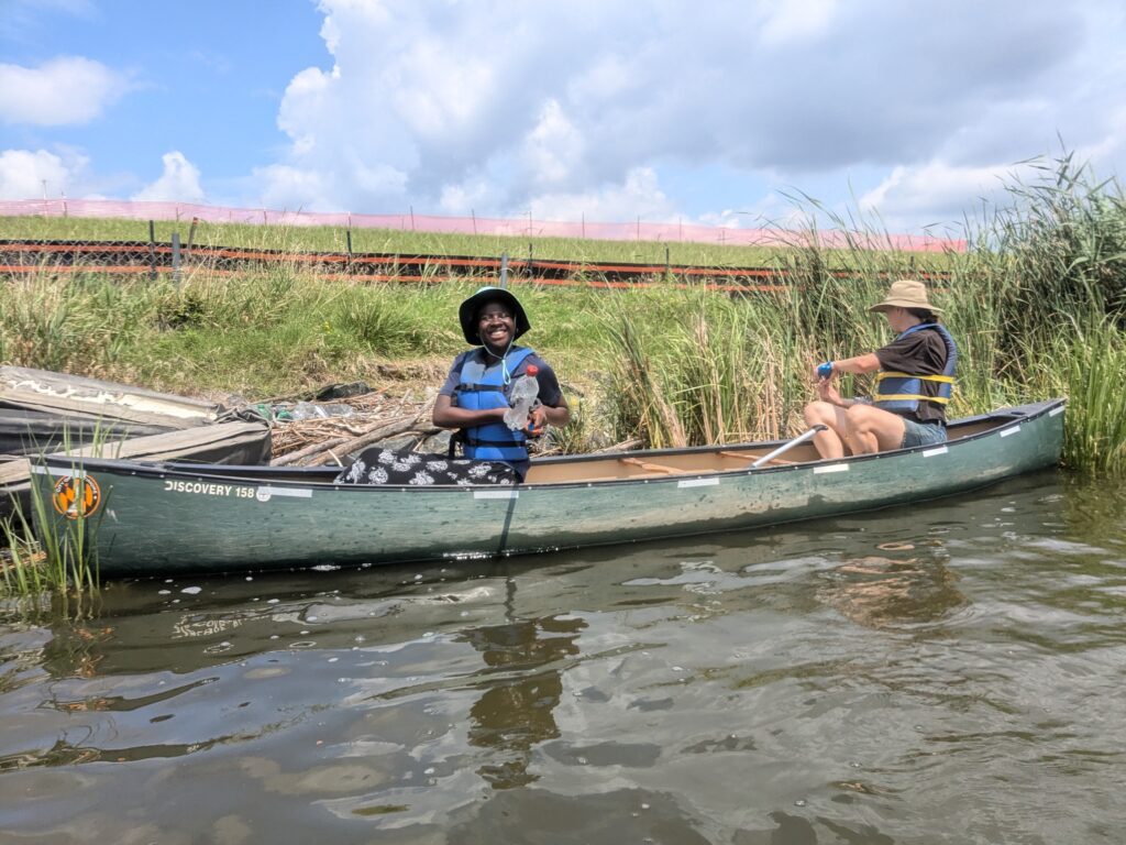 two people in a canoe on the water