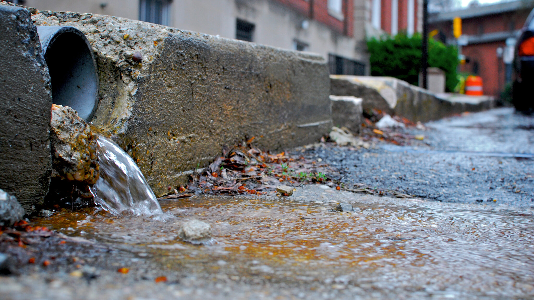 a street with a pipe running out of it