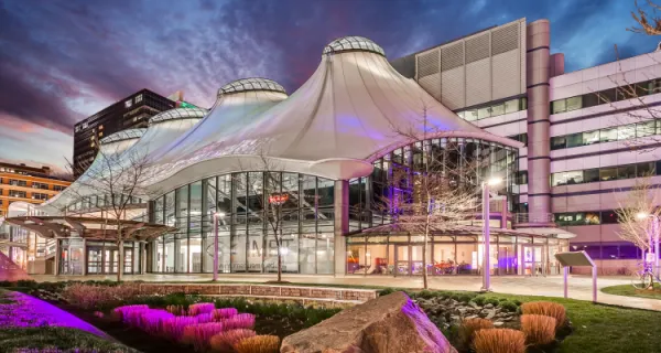 a large building with a large white roof